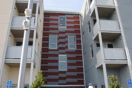 Designed by Michael Willis Architects, Acts Cyrene Apartments has a mix of one-, two-, and three-bedroom units that serve residents earning 30% to 50% of the area median income. Fourteen units have been reserved for individuals who were homeless or at risk of homelessness.