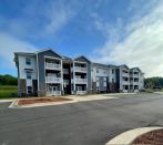 Oak View includes a playground, landscaped grounds, green space, a community center, and on-site parking.