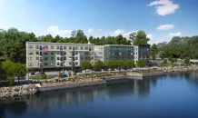 The Eastwalk is projected to be ready for occupancy in July 2026. Amenities will include a community room with kitchen, a workspace for residents, a fitness room, an interior bike storage room, and an on-site management/leasing office.